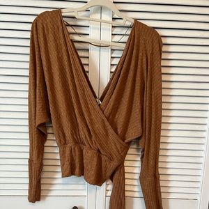 Free People, crop top. Long sleeve, V-neck front and back. Tie on waist.